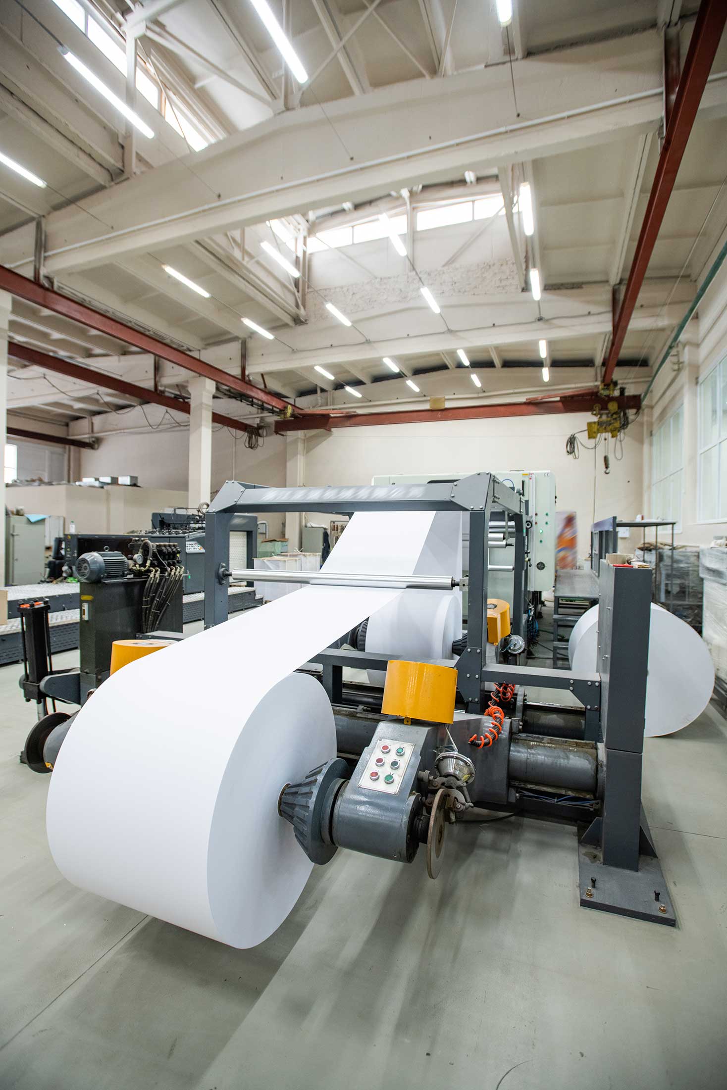 automated-printing-press-with-white-paper-roll-industrial-shop